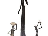 three statues of a woman holding a bowl and a man holding a bowl