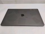 an apple macbook pro laptop sitting on top of a white table