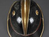 a black and gold helmet with a bird ' s face on it