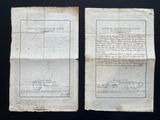 two old papers with writing on them sitting on a table