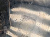 a close up of a metal object with writing on it