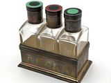three bottles that are sitting on top of a table