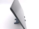 a close up of a laptop on a stand on a white surface