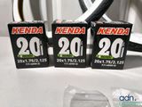three black and white boxes with numbers on them sitting on a table