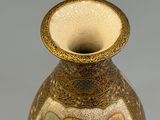 a vase that has a picture of people on it