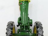 a toy tractor that is attached to a wall
