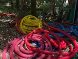 a lot of hoses that are laying on the ground