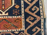 a close up of a rug with a pattern on it