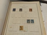 a book with stamps on it sitting on a table