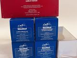 three boxes of blue and red soap sitting on top of each other