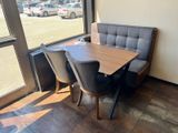 a table and chairs in the corner of a restaurant