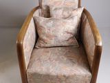 an image of a chair with a pillow on top of it