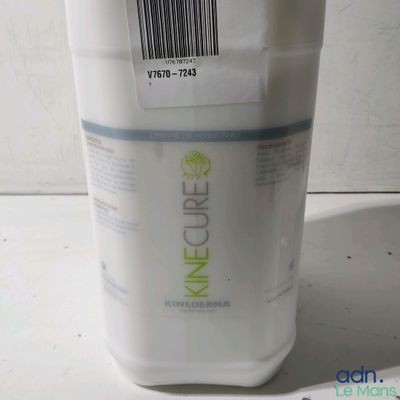 a white container with a barcode on the side of it