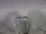 a clear glass vase with a black label on it