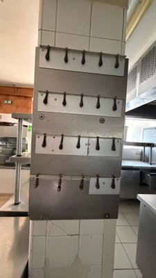 a picture of a commercial kitchen with a lot of counter space