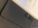an image of a black and white phone sitting on top of a table