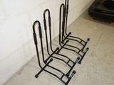 a rack that has five pairs of shoes on it