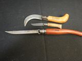 three different types of knives on a black surface