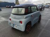 a small car that is parked in a parking lot