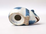 a white and blue vase with a blue stripe on it