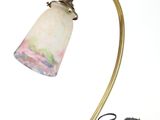 brass table lamp with a marble shade and a black cord
