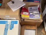many boxes of mail sitting on the floor next to each other