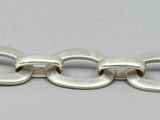 a close up of a silver bracelet with a clasp on it