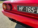 a close up of the rear end of a red sports car