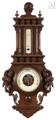 a clock on the wall with a barometer on it