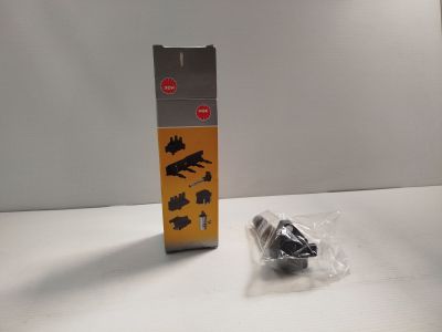 une petite boîte sur laquelle est collé un autocollant noir et jaune