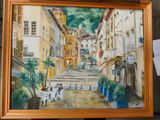 a picture of a painting of a street with people sitting at tables