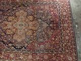 an image of a large oriental rug on the floor
