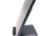 a phone that is sitting on top of a stand