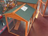 a small dog house in the middle of a store