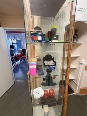 a glass display case with a lot of items in it