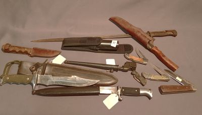 many different types of knives that are on the table