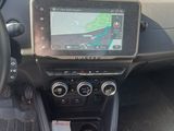 the dashboard of a car with a gps device in the center