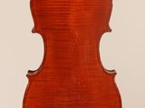 an old violin with a wooden back and a long neck