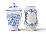 two blue and white vases sitting next to each other
