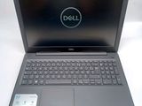 the dell laptop is open and ready to be used