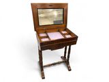 an old wooden desk with a mirror on top of it