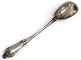 a silver spoon with a handle on a white surface