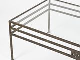 an image of a glass coffee table with metal legs and a glass top