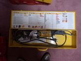 a yellow box that has a tool in it