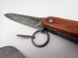 a pair of scissors and a keychain on a table