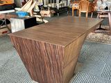 a large wooden table in the middle of a living room