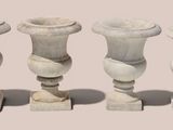 three vases sitting next to each other on a table