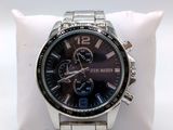 the watch is on a white pillow on a white surface