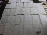 a lot of drawings on the table in the room