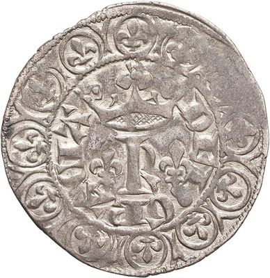 a close up of a silver coin on a white background